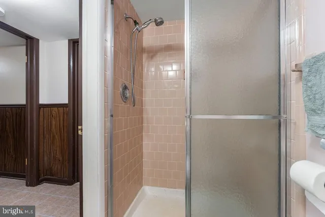 a view of a porch with furniture and front door
