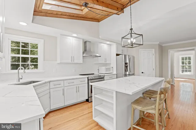 a kitchen with a stove a sink and dishwasher