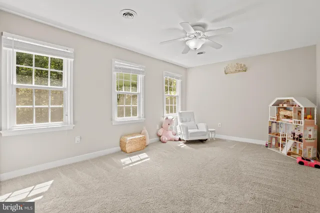 a view of livingroom with furniture and windows