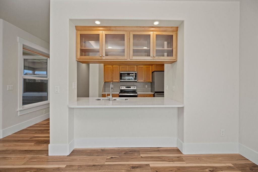 1243 Periwinkle Street Fruita, CO 81521 - Photo 12 of 24 a kitchen with a sink and cabinets