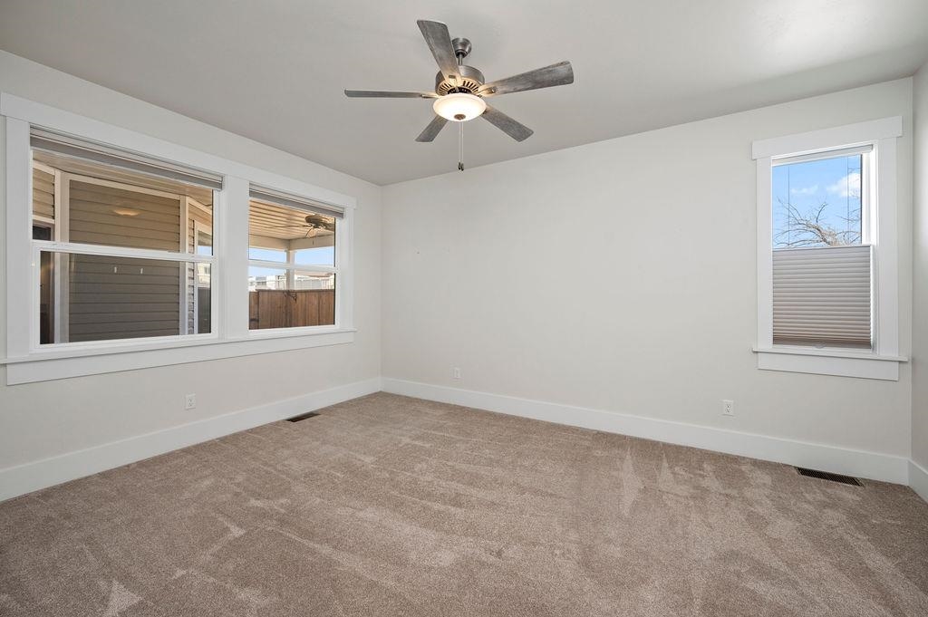 1243 Periwinkle Street Fruita, CO 81521 - Photo 15 of 24 a view of an empty room with a window