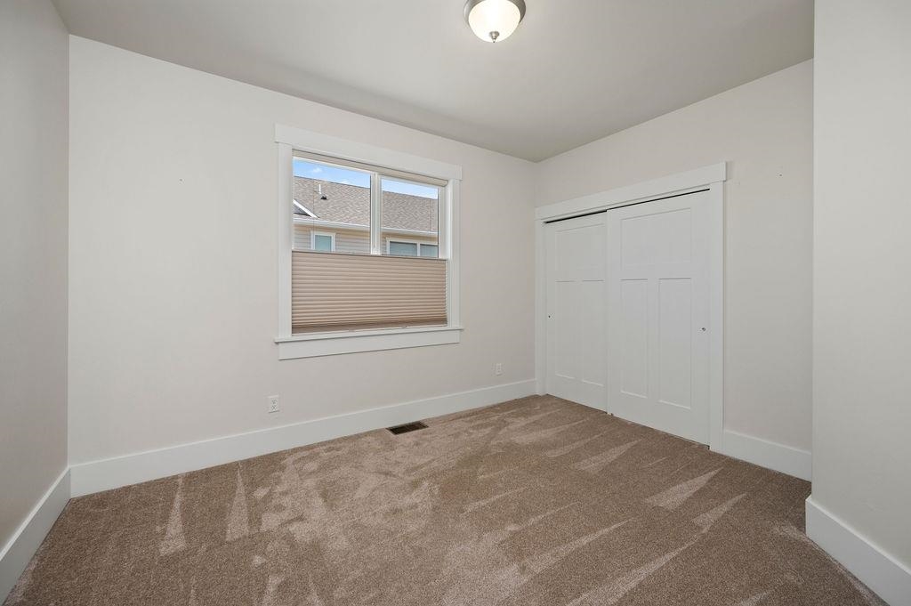 1243 Periwinkle Street Fruita, CO 81521 - Photo 19 of 24 an empty room with a window