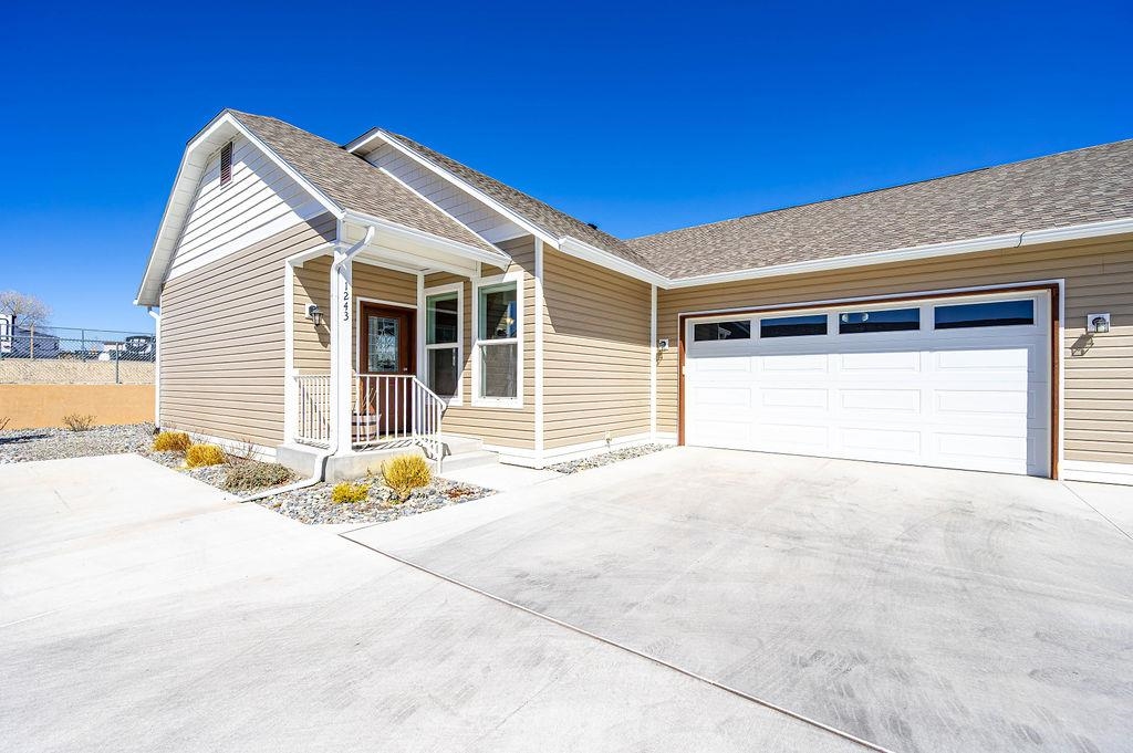 1243 Periwinkle Street Fruita, CO 81521 - Photo 2 of 24 a view of a house with a patio