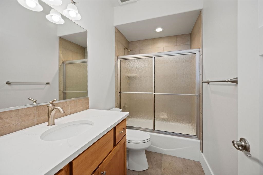 1243 Periwinkle Street Fruita, CO 81521 - Photo 21 of 24 a bathroom with a sink a toilet and shower