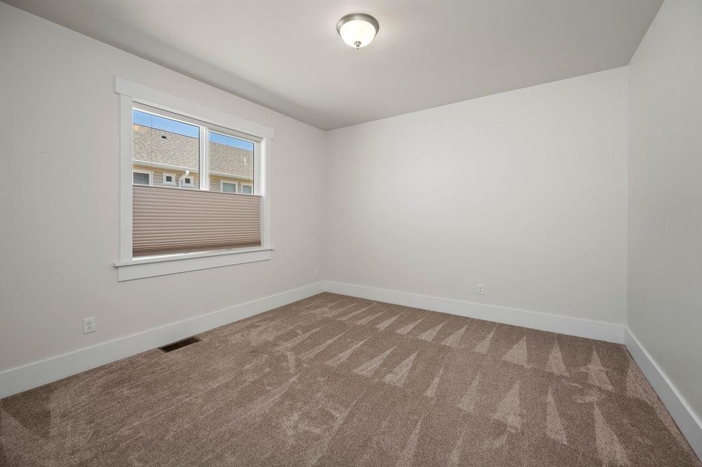 1243 Periwinkle Street Fruita, CO 81521 - Photo 22 of 24 an empty room with a window