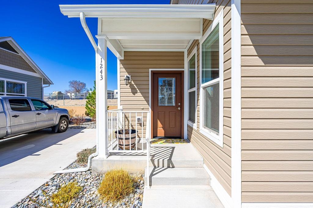 1243 Periwinkle Street Fruita, CO 81521 - Photo 3 of 24 a view of a balcony with furniture