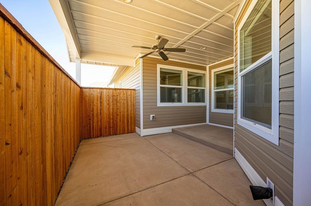 1243 Periwinkle Street Fruita, CO 81521 - Photo 6 of 24 a view of a porch with wooden floor and stairs