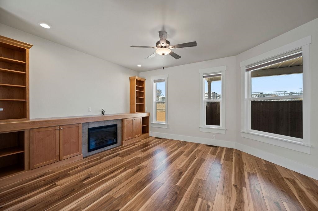 1243 Periwinkle Street Fruita, CO 81521 - Photo 8 of 24 a view of an empty room with a kitchen and a fireplace