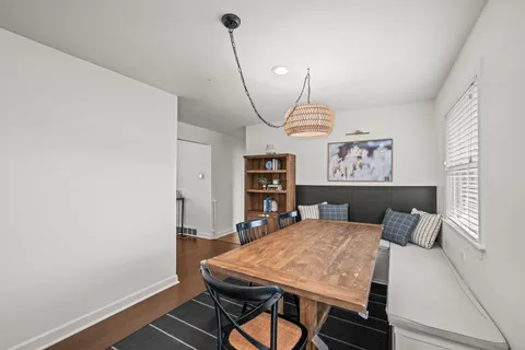 a view of a chairs and table in the balcony