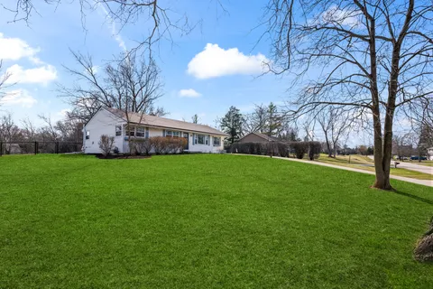 a kitchen with stainless steel appliances granite countertop a stove top oven a refrigerator a sink and a island