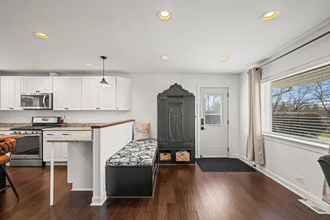 a kitchen with a stove a sink and a refrigerator