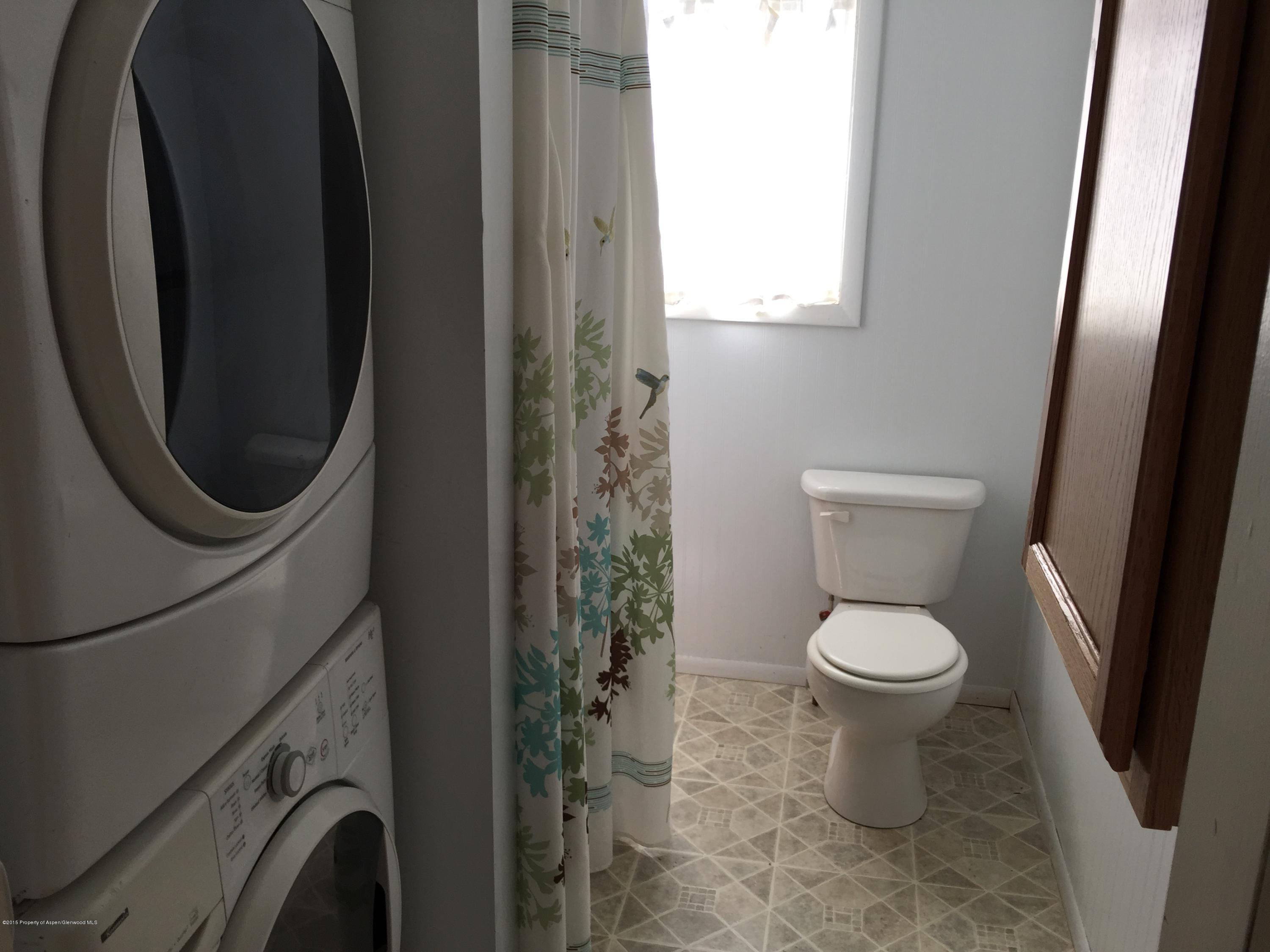 153 East 11th Street Rifle, CO 81650 - Photo 8 of 10 a bathroom with a toilet and a sink