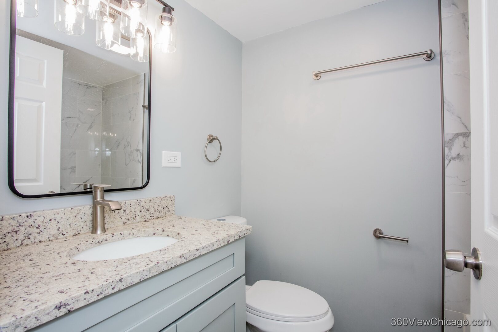 9015 South Carpenter Street Chicago, IL 60620 - Photo 16 of 23 a bathroom with a granite countertop sink toilet and mirror