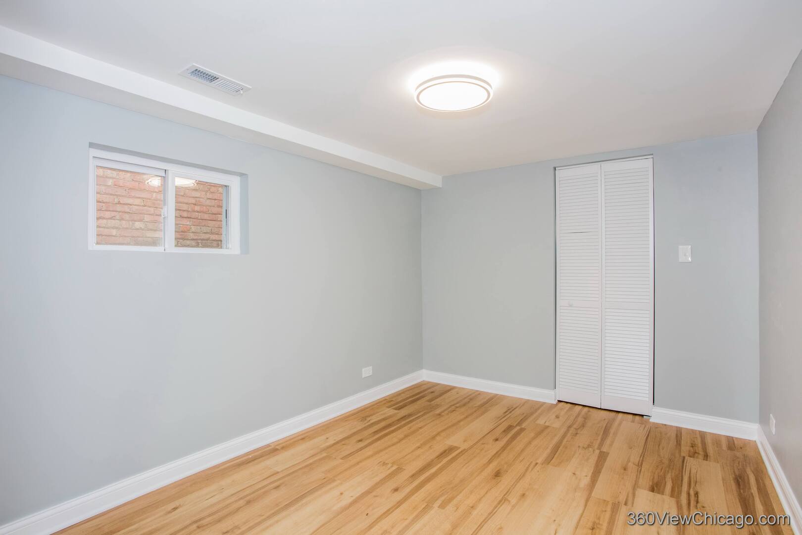 9015 South Carpenter Street Chicago, IL 60620 - Photo 18 of 23 a view of empty room with wooden floor