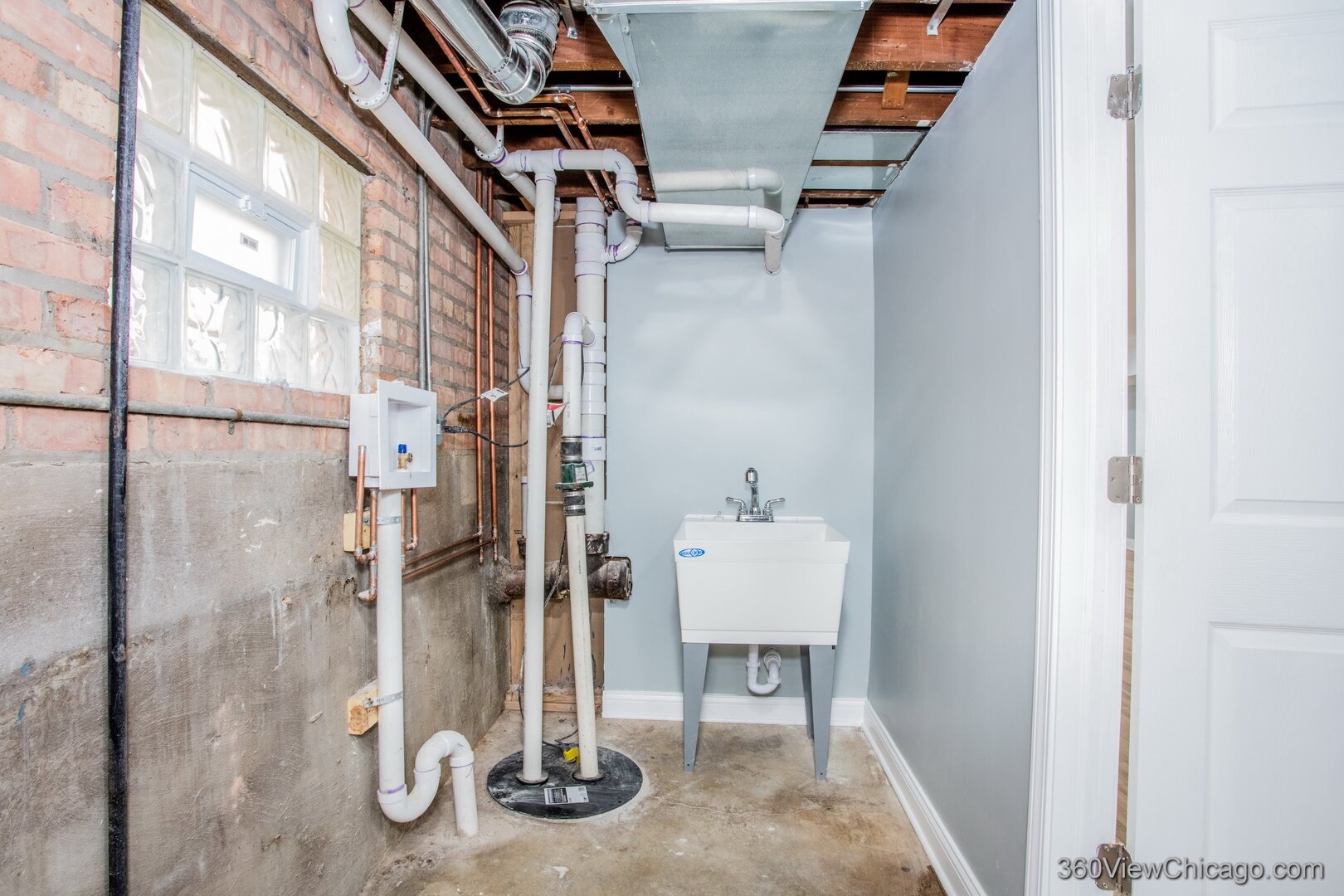 9015 South Carpenter Street Chicago, IL 60620 - Photo 20 of 23 a view of water heater room with wooden floor