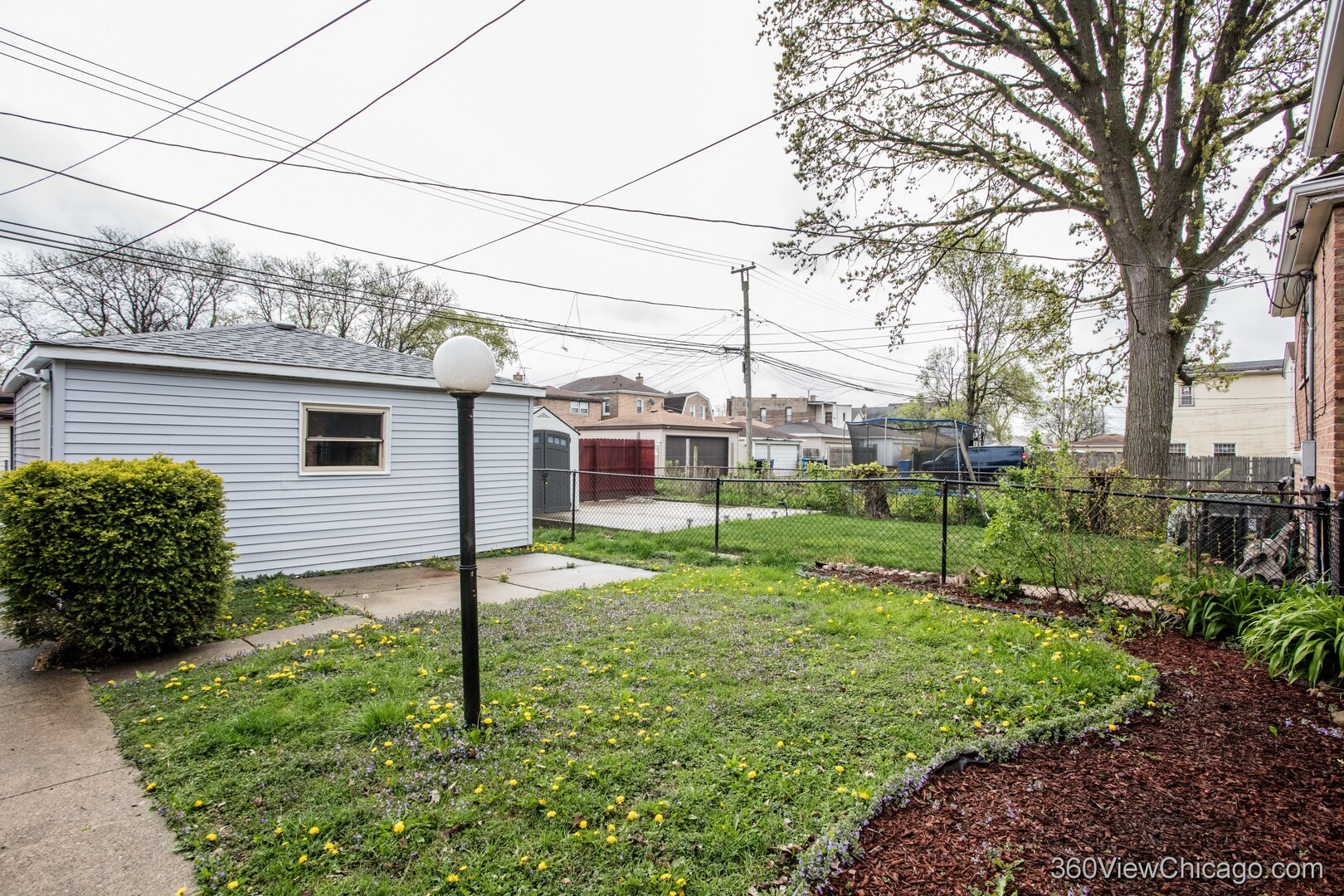 9015 South Carpenter Street Chicago, IL 60620 - Photo 22 of 23 a view of a house with backyard and sitting area