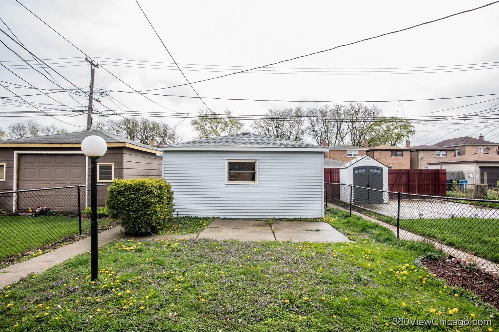 9015 South Carpenter Street Chicago, IL 60620 - Photo 23 of 23 a view of a house with a yard and plants