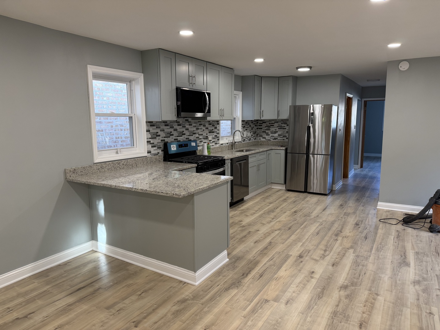 9015 South Carpenter Street Chicago, IL 60620 - Photo 6 of 23 a kitchen with a refrigerator and a stove top oven