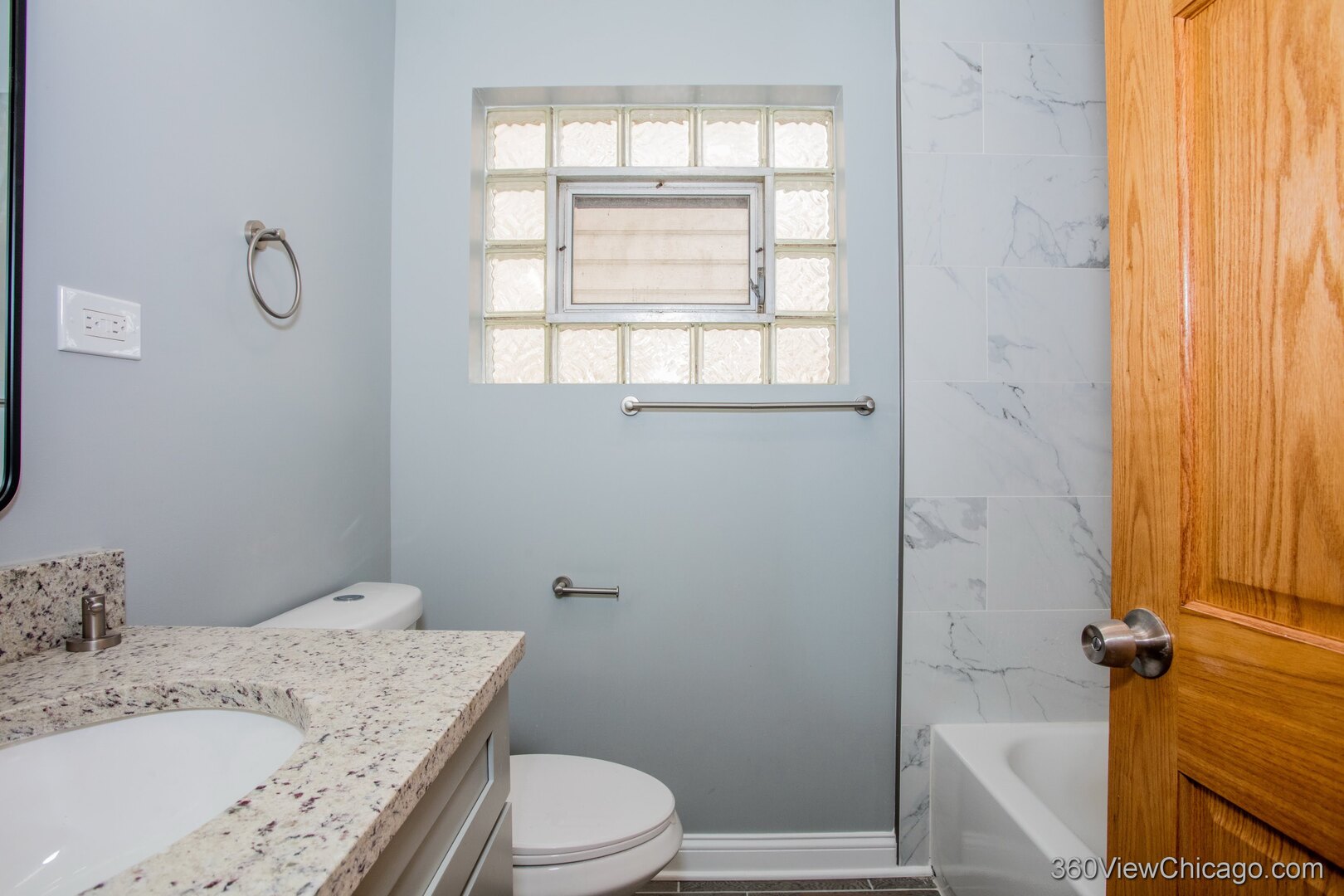 9015 South Carpenter Street Chicago, IL 60620 - Photo 7 of 23 a bathroom with a granite countertop sink toilet and shower