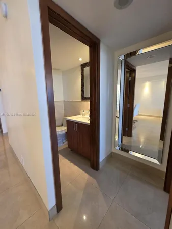a bathroom with a shower and mirror