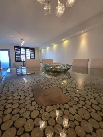 a living room with furniture and a night stand