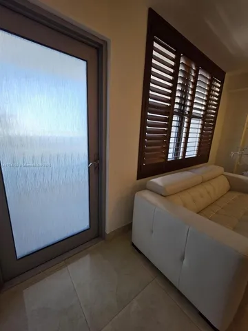 a view of balcony with furniture