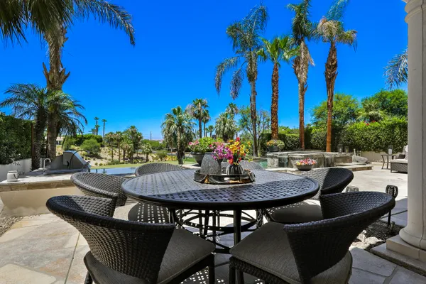a view of a patio with swimming pool
