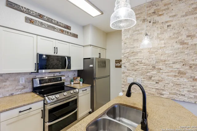 a kitchen with a stove and a microwave