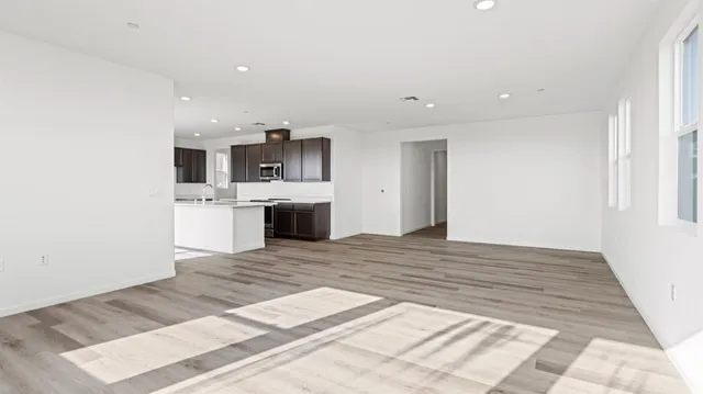 a view of kitchen with sink microwave and stove