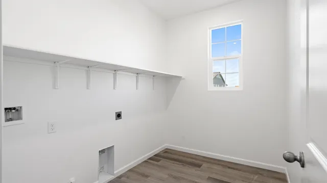 a view of small space with wooden floor and windows