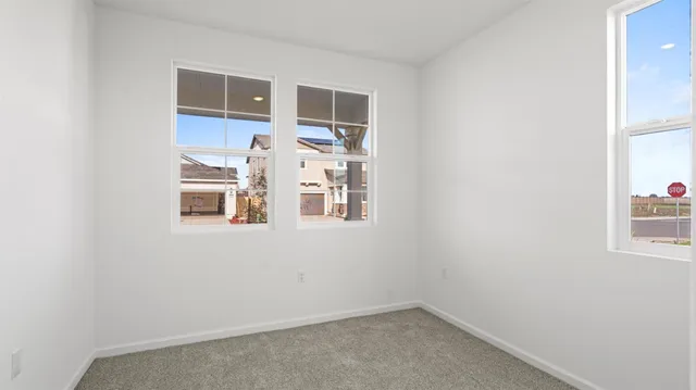 a view of storage and utility room with a window
