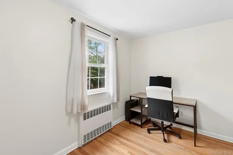 a workspace with furniture and a window