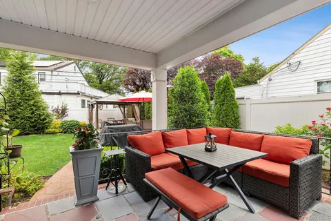 a outdoor living space with furniture and garden