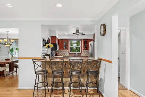 a view of a dining room with furniture and window