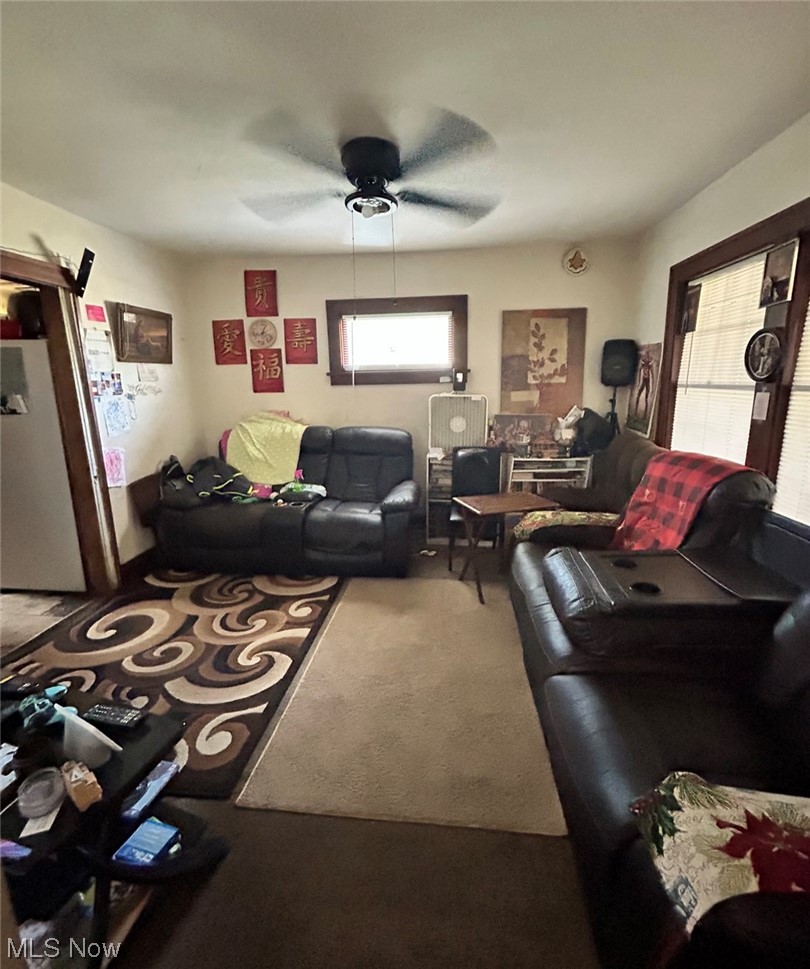 1450 Clearaire Road Cleveland, OH 44110 - Photo 19 of 27 Carpeted living room featuring ceiling fan