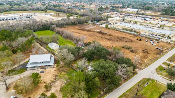 an aerial view of residential houses with outdoor space