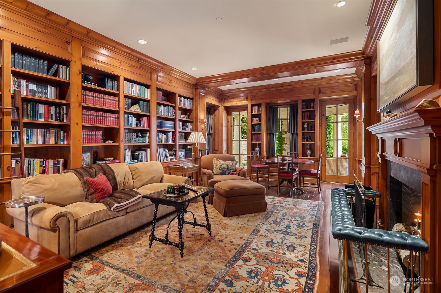 7002 North Mercer Way Mercer Island, WA 98040 - Photo 12 of 34 a living room with furniture and a bookshelf