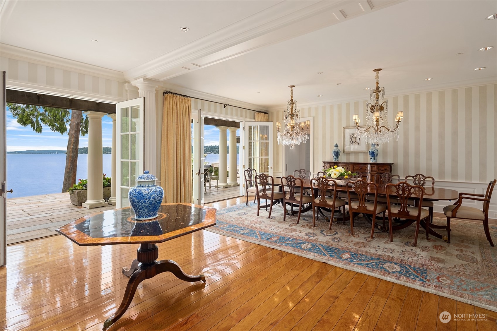 7002 North Mercer Way Mercer Island, WA 98040 - Photo 18 of 34 a dining room with furniture floor to ceiling windows and chairs