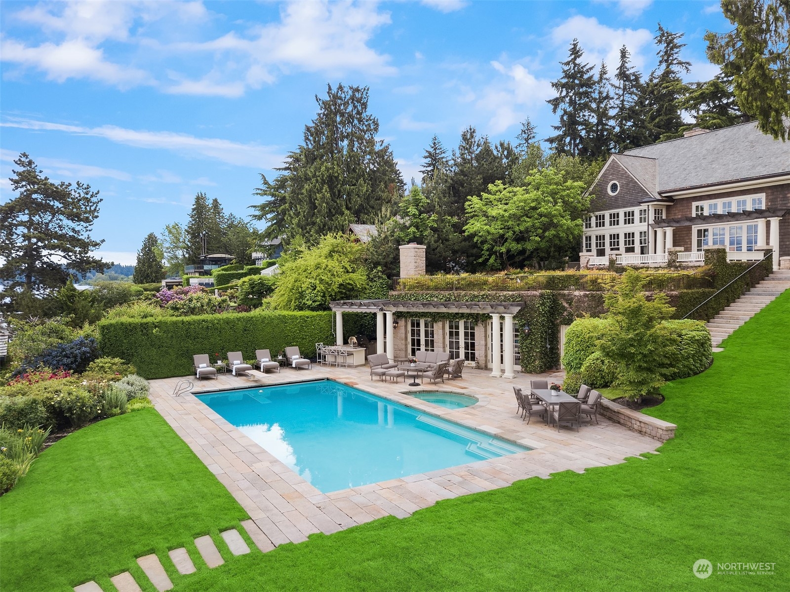 7002 North Mercer Way Mercer Island, WA 98040 - Photo 28 of 34 a view of a house with a yard patio and swimming pool