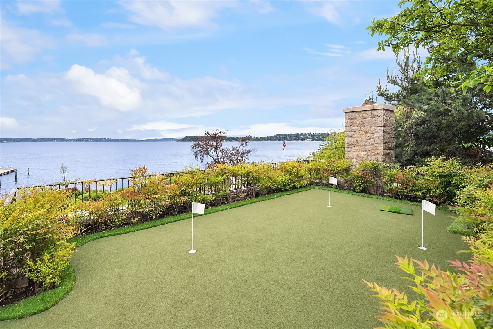 7002 North Mercer Way Mercer Island, WA 98040 - Photo 29 of 34 a view of a lake with a building in the background