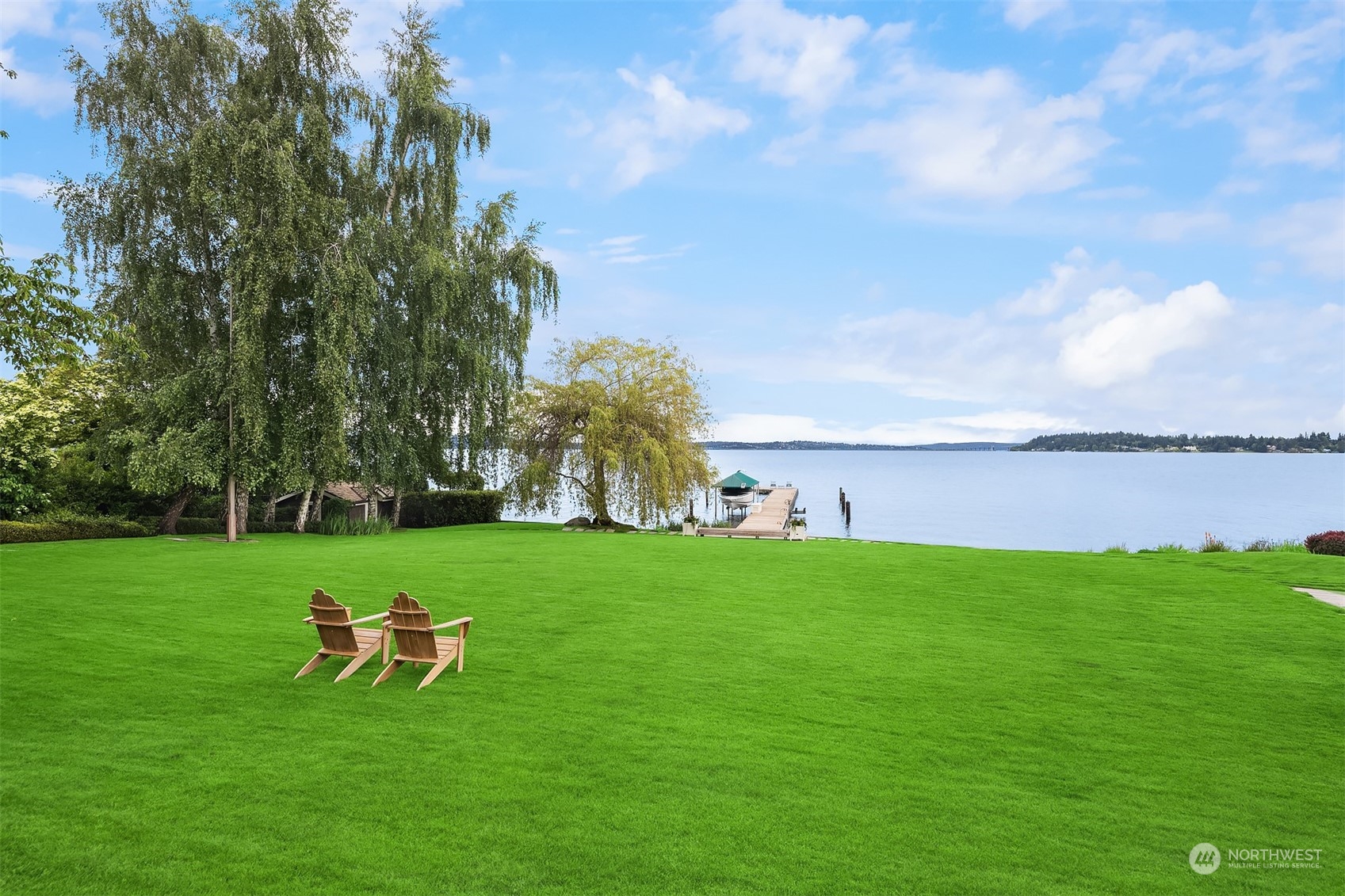 7002 North Mercer Way Mercer Island, WA 98040 - Photo 5 of 34 a green field with trees in the background