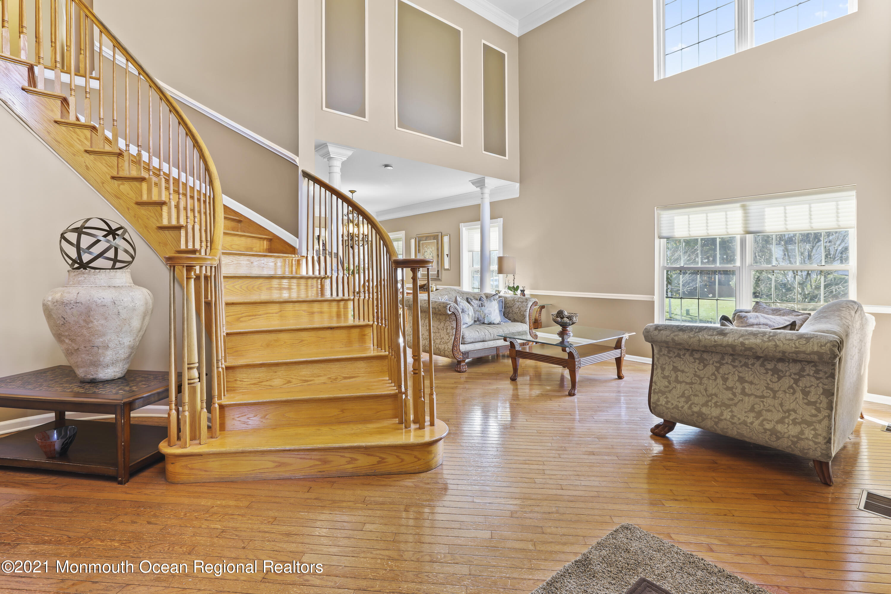 59 Mill Pond Road Jackson, NJ 08527 - Photo 4 of 30 a living room with furniture and a floor to ceiling window