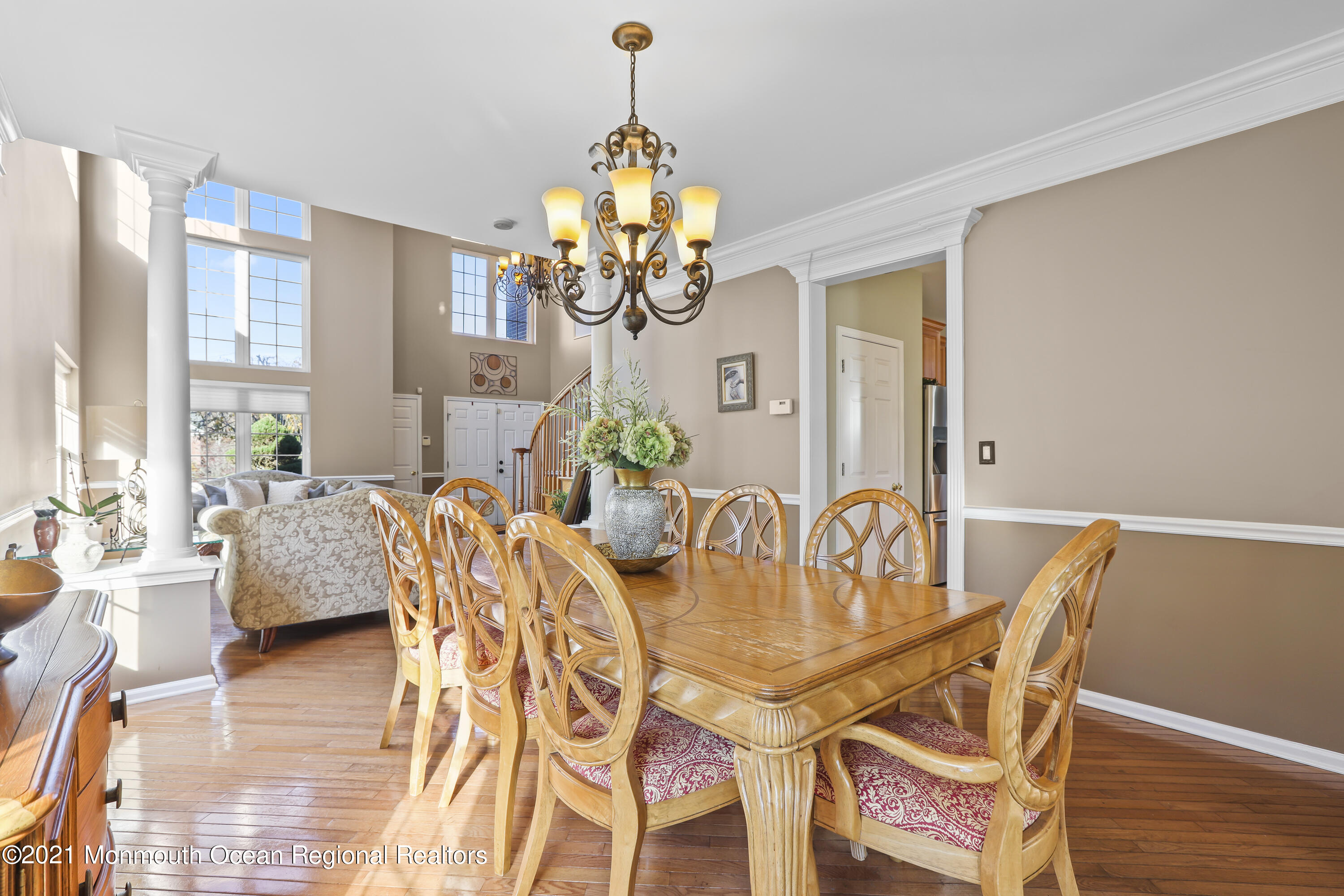 59 Mill Pond Road Jackson, NJ 08527 - Photo 8 of 30 a dining room with furniture a chandelier and wooden floor