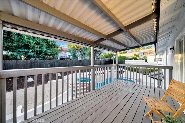 a bedroom with a bed and a ceiling fan