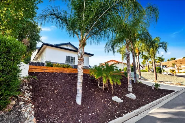 an aerial view of a house with a yard and garden
