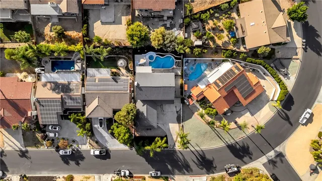 an aerial view of residential houses with outdoor space