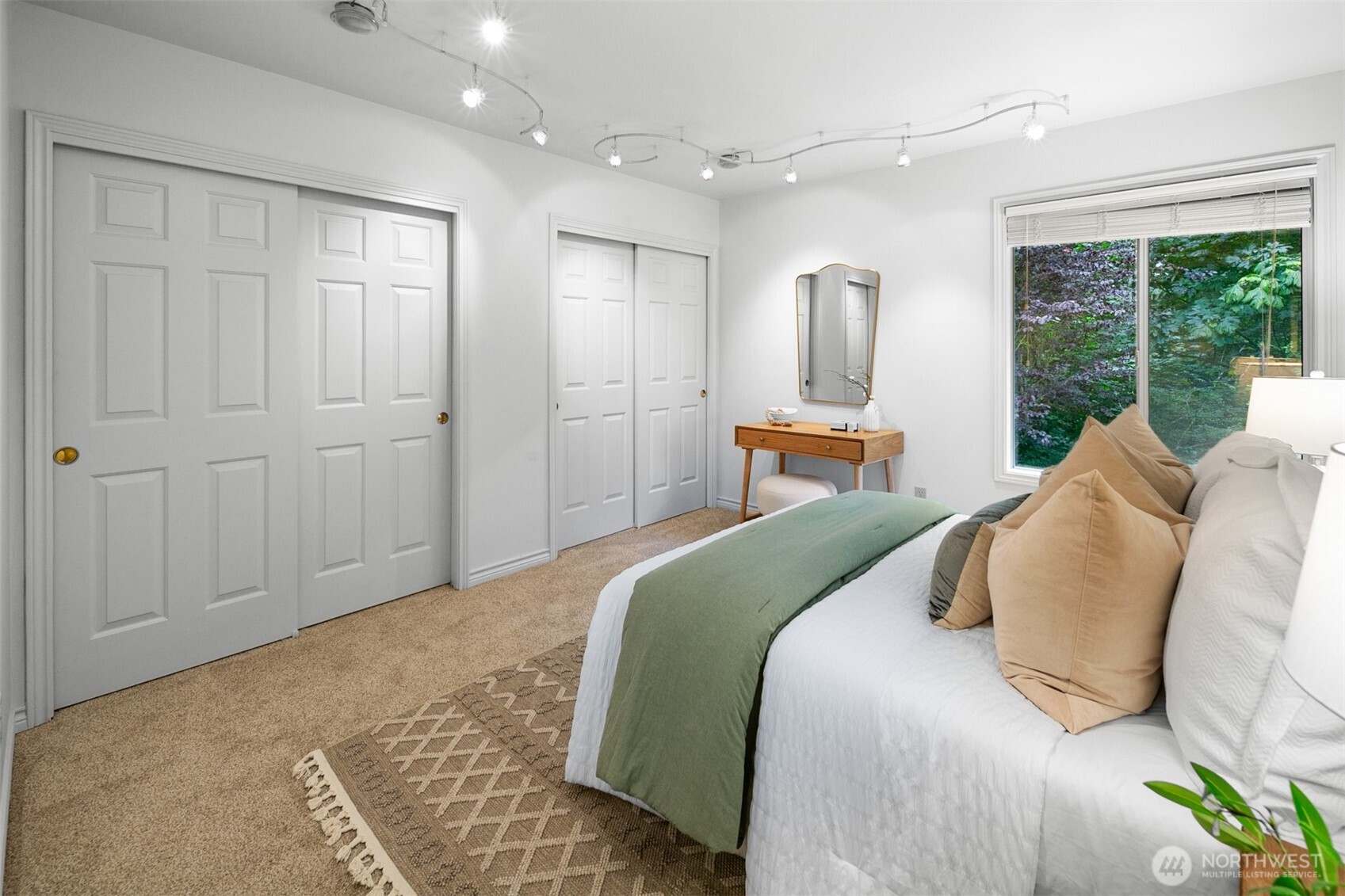 16116 68th Avenue West Edmonds, WA 98026 - Photo 26 of 40 a bedroom with a large bed and large window