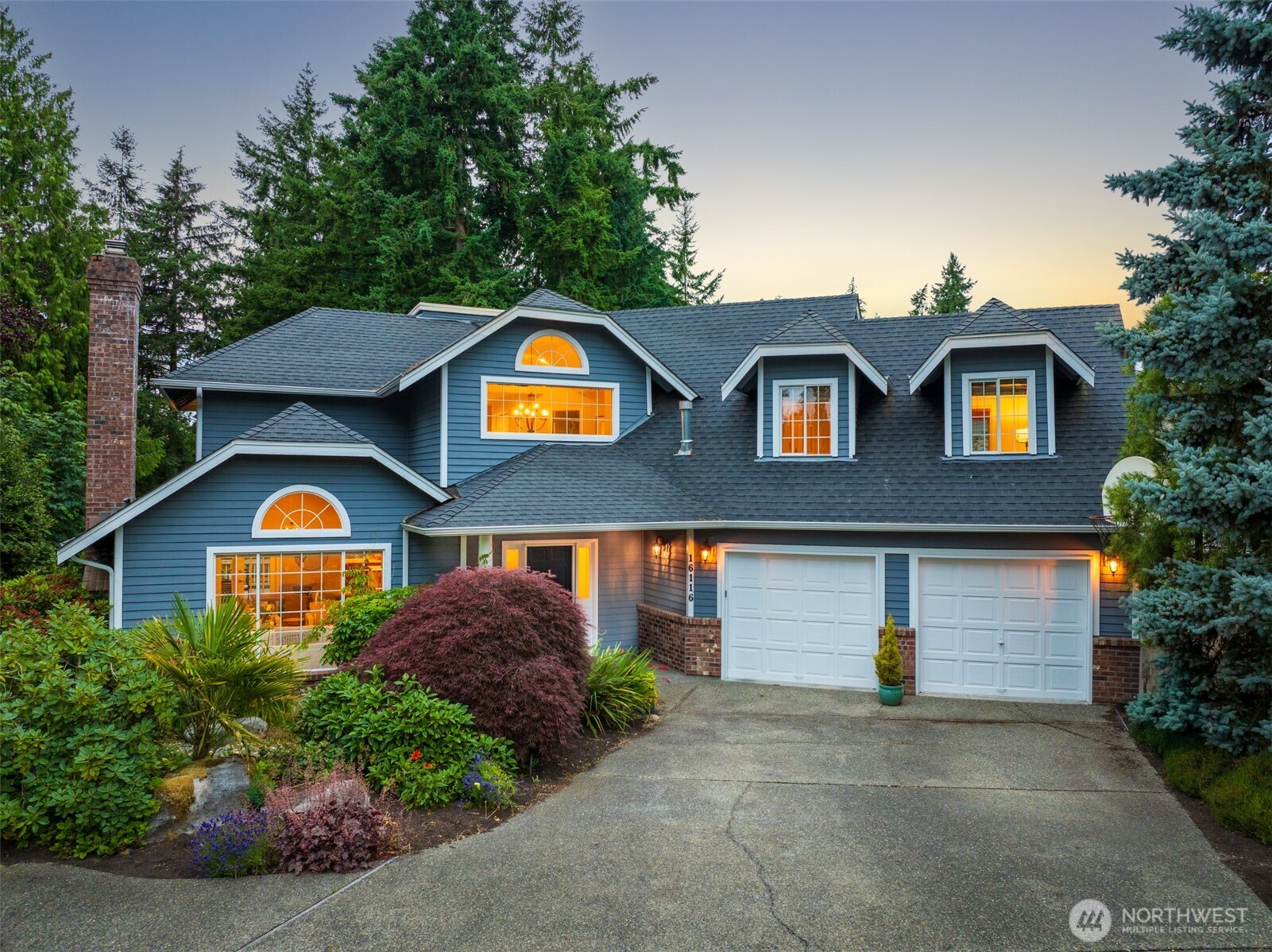 16116 68th Avenue West Edmonds, WA 98026 - Photo 35 of 40 a front view of a house with a garden