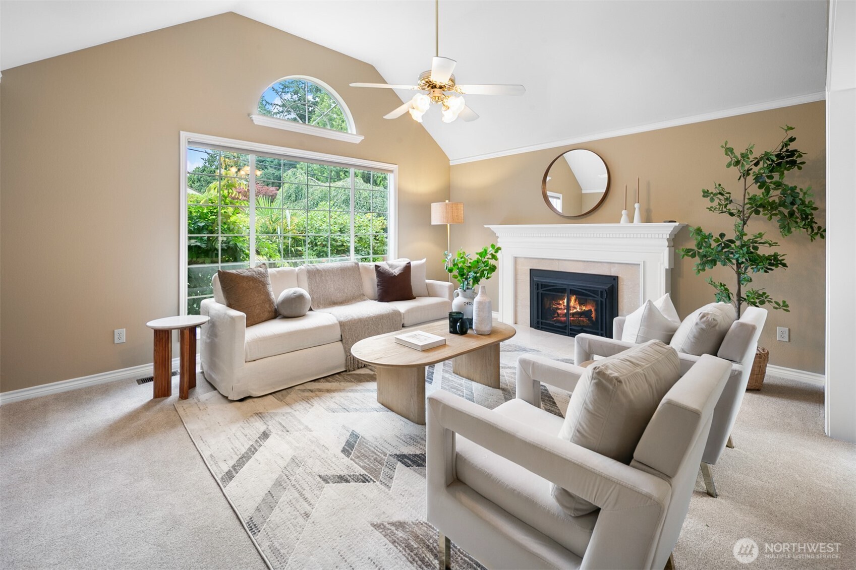 16116 68th Avenue West Edmonds, WA 98026 - Photo 5 of 40 a living room with furniture a large window and a fireplace