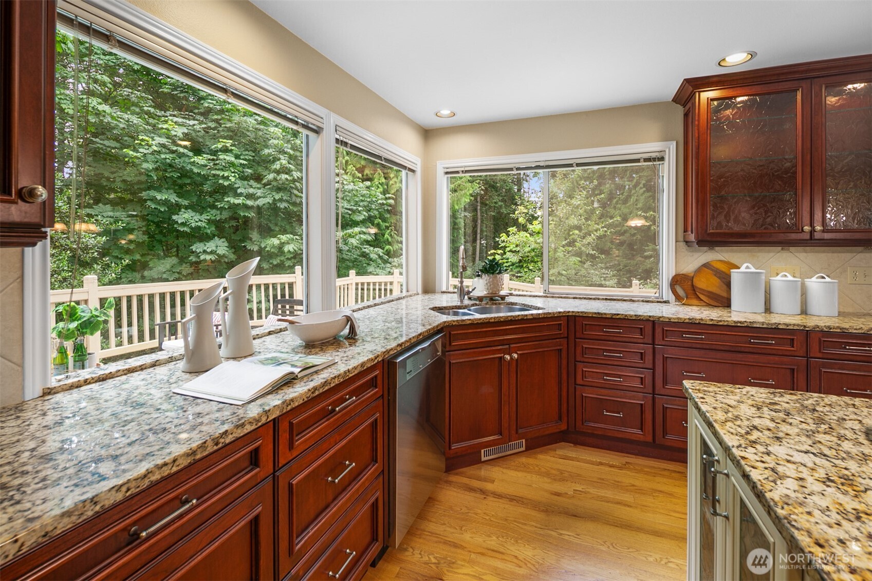 16116 68th Avenue West Edmonds, WA 98026 - Photo 7 of 40 a kitchen with granite countertop a sink a counter space and cabinets